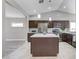Well-lit kitchen with a center island, stainless steel appliances, and an open layout at 2848 Skowhegan Dr, Henderson, NV 89074
