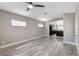 Cozy living room with wood-look floors leading into the kitchen at 2848 Skowhegan Dr, Henderson, NV 89074