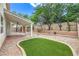 Inviting backyard with lush landscaping, covered patio, and a gazebo for outdoor enjoyment at 3065 Blue Monaco St, Las Vegas, NV 89117