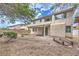 Charming backyard with desert landscaping, covered patio, and a small wooden bridge for added appeal at 3065 Blue Monaco St, Las Vegas, NV 89117
