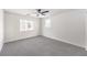 Minimalist bedroom with ceiling fan, neutral walls, and carpet at 3065 Blue Monaco St, Las Vegas, NV 89117