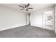 Bedroom with carpeting, a ceiling fan, and ensuite bath at 3065 Blue Monaco St, Las Vegas, NV 89117