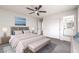 Calming bedroom with neutral tones, large bed, and ensuite bathroom, creating a peaceful retreat at 3065 Blue Monaco St, Las Vegas, NV 89117