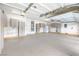 Spacious garage with plenty of storage cabinets and epoxy flooring for a clean and organized space at 3065 Blue Monaco St, Las Vegas, NV 89117