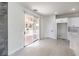 Bright kitchen area with sliding glass doors leading to a landscaped backyard and modern white cabinets at 3065 Blue Monaco St, Las Vegas, NV 89117