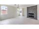 Bright living room with modern fireplace, light wood floors, and plenty of natural light at 3065 Blue Monaco St, Las Vegas, NV 89117