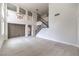 Bright, open-concept living room with wood floors, high ceilings, and a decorative chandelier at 3065 Blue Monaco St, Las Vegas, NV 89117