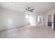 Spacious primary bedroom featuring a ceiling fan, neutral paint, and wood-look floors at 3065 Blue Monaco St, Las Vegas, NV 89117