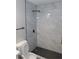 Beautiful tiled shower with a rainfall shower head and black accents at 3219 Bluebird St, Las Vegas, NV 89121