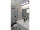 Updated bathroom boasts a modern vanity and walk-in shower with rainfall shower head at 3219 Bluebird St, Las Vegas, NV 89121