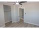 Bright bedroom featuring a ceiling fan and large closets with ample storage space at 3219 Bluebird St, Las Vegas, NV 89121
