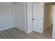 Bedroom with bi-fold closet, wood floors, and neutral colors throughout at 3219 Bluebird St, Las Vegas, NV 89121