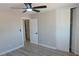 Bedroom with ceiling fan, wood-look floors, closet, and neutral paint at 3219 Bluebird St, Las Vegas, NV 89121