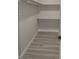 Walk-in closet with rod and shelving ready for organization, and wood-look floors at 3219 Bluebird St, Las Vegas, NV 89121
