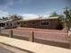 Charming single-story home with a well-maintained yard and white picket fence at 3219 Bluebird St, Las Vegas, NV 89121