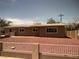 Charming single-story home with a well-maintained yard and white picket fence at 3219 Bluebird St, Las Vegas, NV 89121