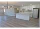 Bright kitchen with white cabinets, a farmhouse sink, island and stainless steel appliances at 3219 Bluebird St, Las Vegas, NV 89121