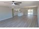 Expansive living room blending the kitchen and dining areas in a bright and airy space at 3219 Bluebird St, Las Vegas, NV 89121