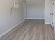 A bright living room showcases modern, light wood flooring and fresh, neutral paint, creating a move-in-ready space at 3219 Bluebird St, Las Vegas, NV 89121