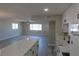 Spacious living room flowing seamlessly into the bright, modern kitchen at 3219 Bluebird St, Las Vegas, NV 89121