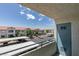Balcony with view of complex featuring covered parking and lush landscaping at 3318 N Decatur Blvd # 2110, Las Vegas, NV 89130