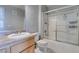 Bathroom featuring a shower-tub combo with a sliding glass door and a single sink vanity at 3318 N Decatur Blvd # 2110, Las Vegas, NV 89130