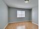 Bright bedroom featuring a window providing natural light and wood-look laminate flooring at 3318 N Decatur Blvd # 2110, Las Vegas, NV 89130