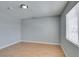 Spacious bedroom featuring a window providing natural light and wood-look laminate flooring at 3318 N Decatur Blvd # 2110, Las Vegas, NV 89130