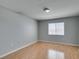 Well-lit bedroom featuring a window providing natural light and wood-look laminate flooring at 3318 N Decatur Blvd # 2110, Las Vegas, NV 89130