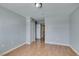 A bedroom with light gray walls, wood flooring and a double door closet at 3318 N Decatur Blvd # 2110, Las Vegas, NV 89130