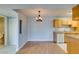 Well-lit dining area with hardwood floors, adjacent to the kitchen and bathroom at 3318 N Decatur Blvd # 2110, Las Vegas, NV 89130