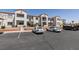 Exterior view of a two-story apartment complex with parking lot and landscaping at 3318 N Decatur Blvd # 2110, Las Vegas, NV 89130