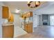Functional kitchen with wooden cabinets, white appliances, and tiled flooring at 3318 N Decatur Blvd # 2110, Las Vegas, NV 89130