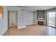 Bright living room boasts wood floors, fireplace, and access to the balcony at 3318 N Decatur Blvd # 2110, Las Vegas, NV 89130