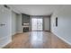 Living room with wood floors, fireplace, and sliding glass door to balcony at 3318 N Decatur Blvd # 2110, Las Vegas, NV 89130