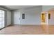 Living room boasts wood floors, balcony access, and leads to a bathroom at 3318 N Decatur Blvd # 2110, Las Vegas, NV 89130
