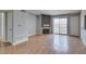 Bright living room boasts wood floors, fireplace, and access to the balcony at 3318 N Decatur Blvd # 2110, Las Vegas, NV 89130