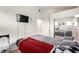 Bedroom with wall-mounted TV, built-in closet, and decor at 3515 Cactus Shadow St # 104, Las Vegas, NV 89129