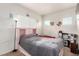 Comfortable bedroom with carpet flooring, natural light, and pink decorative elements at 3515 Cactus Shadow St # 104, Las Vegas, NV 89129