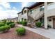 Exterior view of the condo, showing the stairs and well-maintained landscaping at 3515 Cactus Shadow St # 104, Las Vegas, NV 89129