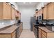 Functional kitchen with ample cabinet space and modern appliances for convenient cooking at 3515 Cactus Shadow St # 104, Las Vegas, NV 89129