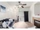Bright living room with a ceiling fan, a fireplace, and a sliding glass door at 3515 Cactus Shadow St # 104, Las Vegas, NV 89129