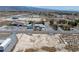 Expansive aerial view of a single-Gathering home with a detached garage amid a desert landscape and mountain backdrop at 3581 Mallard Ave, Pahrump, NV 89048