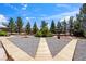 Enjoy outdoor living with a beautifully landscaped backyard and multiple wooden pathways at 3581 Mallard Ave, Pahrump, NV 89048