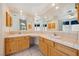 Bathroom boasts dual sinks, a tile countertop, and a full mirror at 3581 Mallard Ave, Pahrump, NV 89048