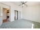 Bright bedroom with new carpet, ceiling fan, and sliding mirrored closet doors at 3581 Mallard Ave, Pahrump, NV 89048