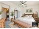 Staged bedroom with new carpet, a bed, bench, and sliding mirrored closet doors at 3581 Mallard Ave, Pahrump, NV 89048
