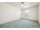 The bedroom features a large window for natural light, carpet, and neutral walls at 3581 Mallard Ave, Pahrump, NV 89048