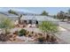 Well-maintained home with desert-friendly landscaping, a circular driveway, and an oversized garage at 3581 Mallard Ave, Pahrump, NV 89048