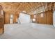 This is a spacious garage with tall ceilings, a staircase, and concrete flooring, ready for versatile use at 3581 Mallard Ave, Pahrump, NV 89048